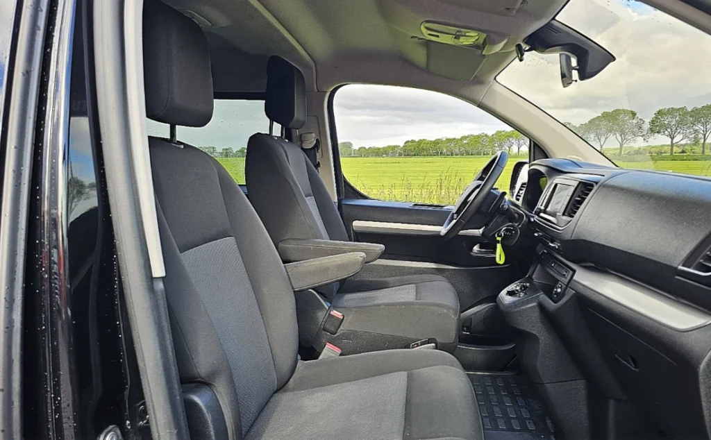 Opel Vivaro interior for rent in Skopje with comfortable front seats and air conditioning